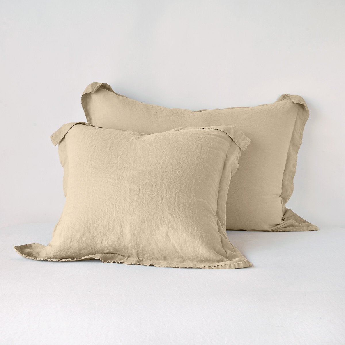 Pair of Bella Notte Honeycomb linen shams stacked, showing relaxed drape and flange edge.