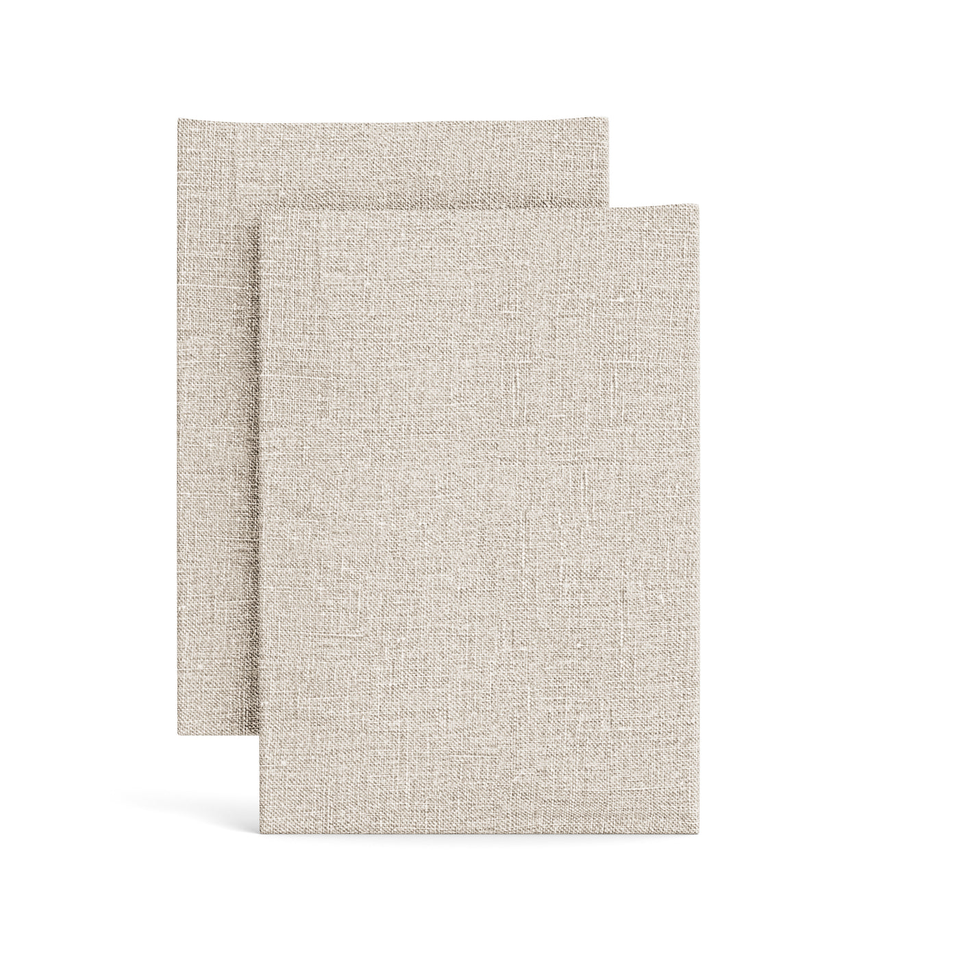 Close-up of two stacked natural linen pillowcases showing woven texture detail.