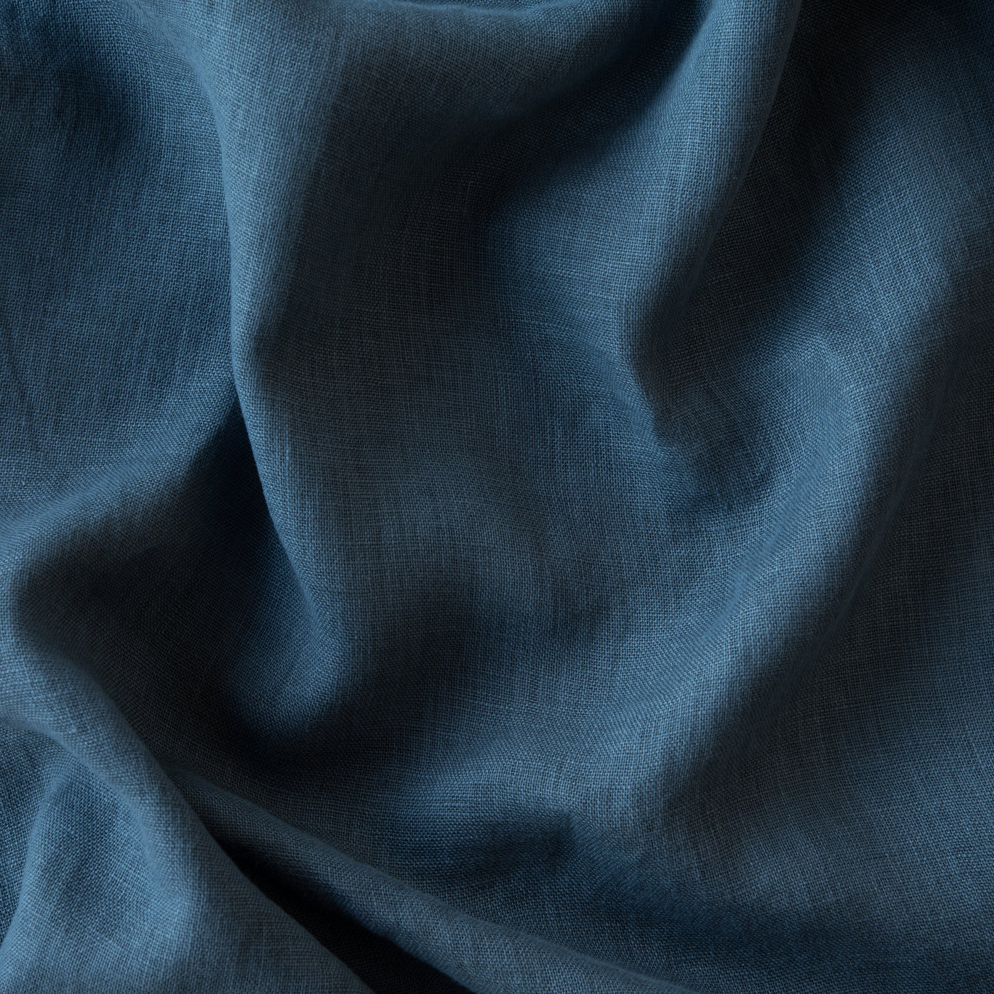 Close-up of Bella Notte Linen Whisper fabric in Midnight, showing soft drape and natural linen weave.
