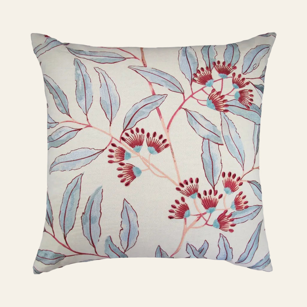 Ann Gish Linenberry pillow in ivory with blue botanical leaves and red berry embroidery.