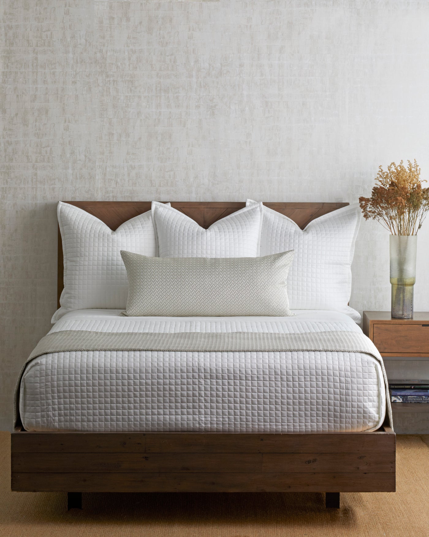 Ann Gish Link bed finisher in ivory diamond quilted pattern on a styled wood-frame bed.