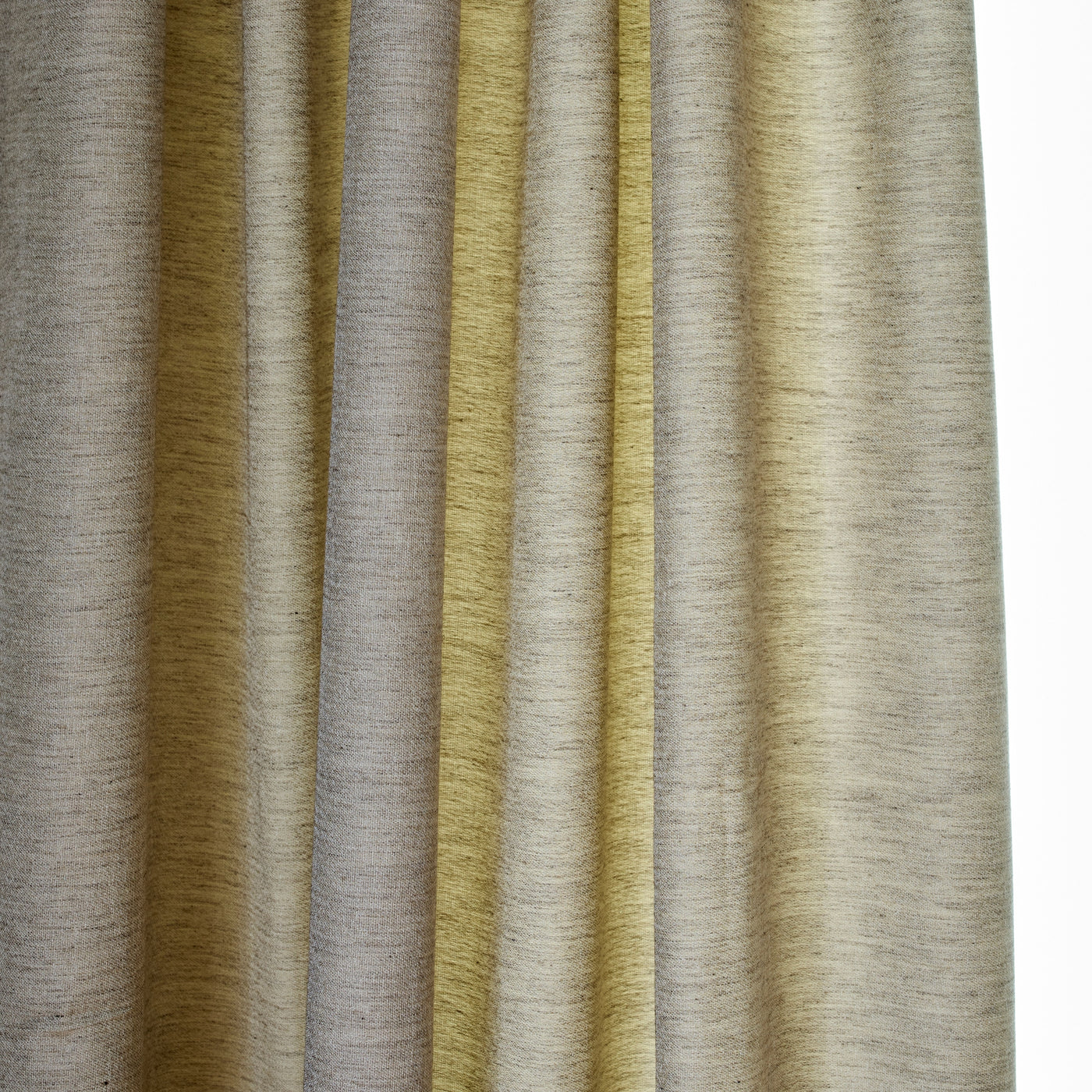 Close-up of Ann Gish Lino curtain panel folds in chartreuse and sand woven linen.
