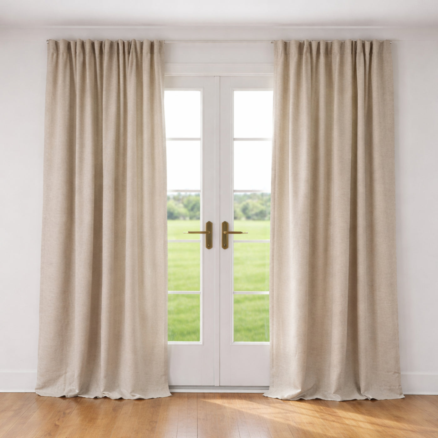 Ann Gish Lino curtain panels in natural linen, styled floor-length framing French doors.