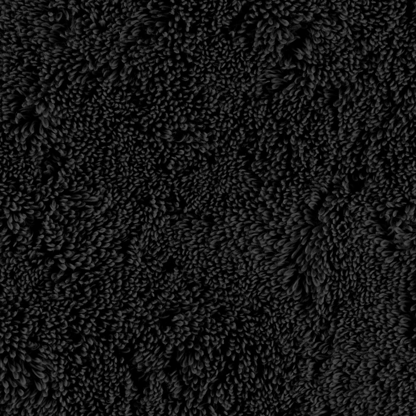 Close-up of Matouk Lotus bath sheet in black, showing dense textured terry loops.