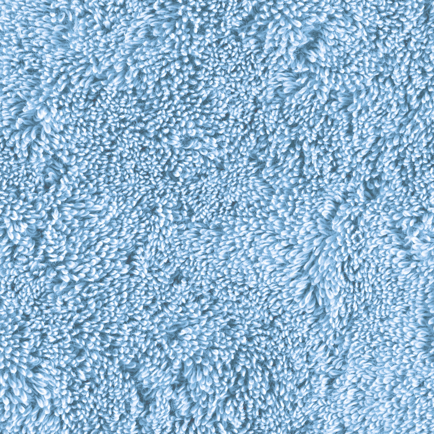 Close-up of sky blue terry loops showing dense, plush texture of Matouk Lotus bath sheet.