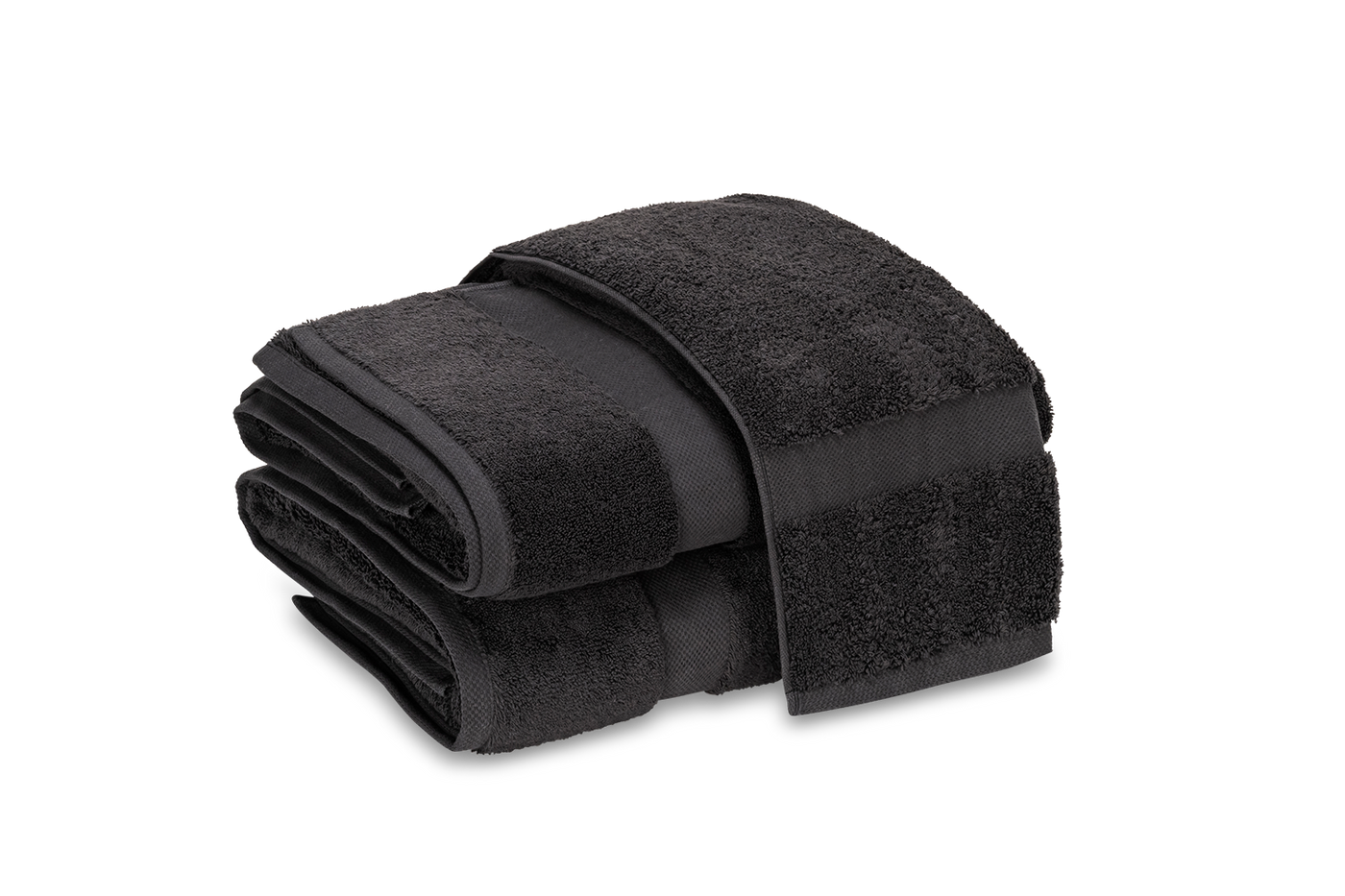 Close-up of folded charcoal Matouk Lotus bath sheets showing dense terry texture.