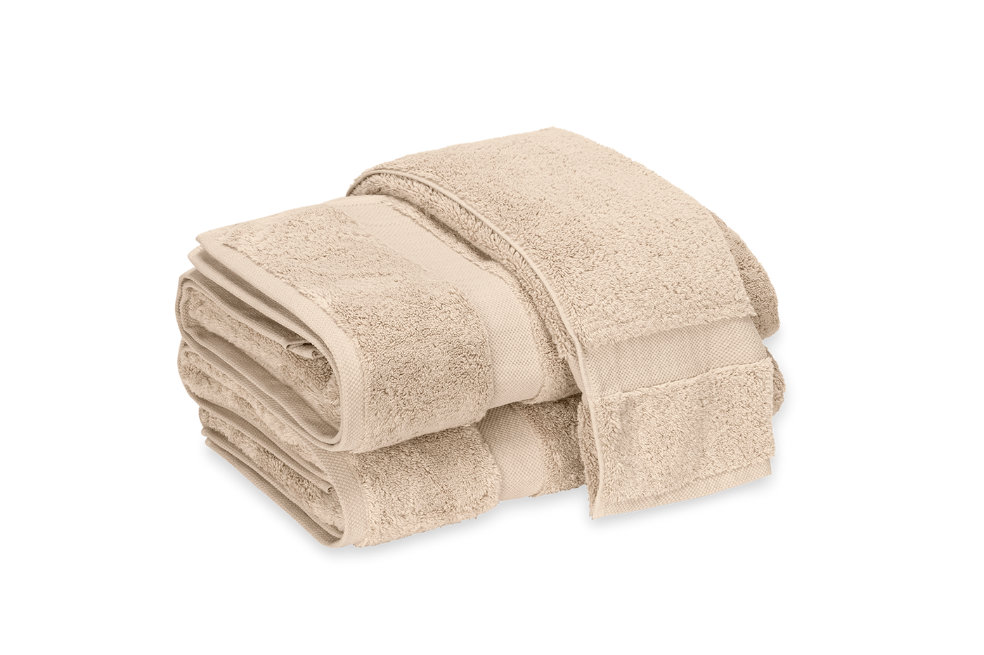 Close-up of stacked sand Matouk Lotus bath sheets showing dobby border detail.