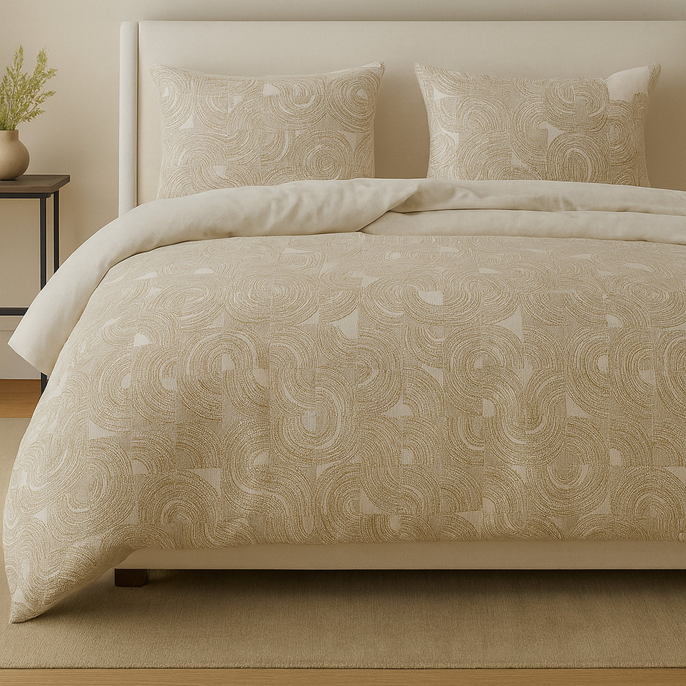 Ann Gish Lugano comforter set styled on bed, champagne tonal swirl embroidery detail.