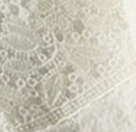 Close-up of ivory cotton lace detailing on Home Treasures Luzon hand towel.
