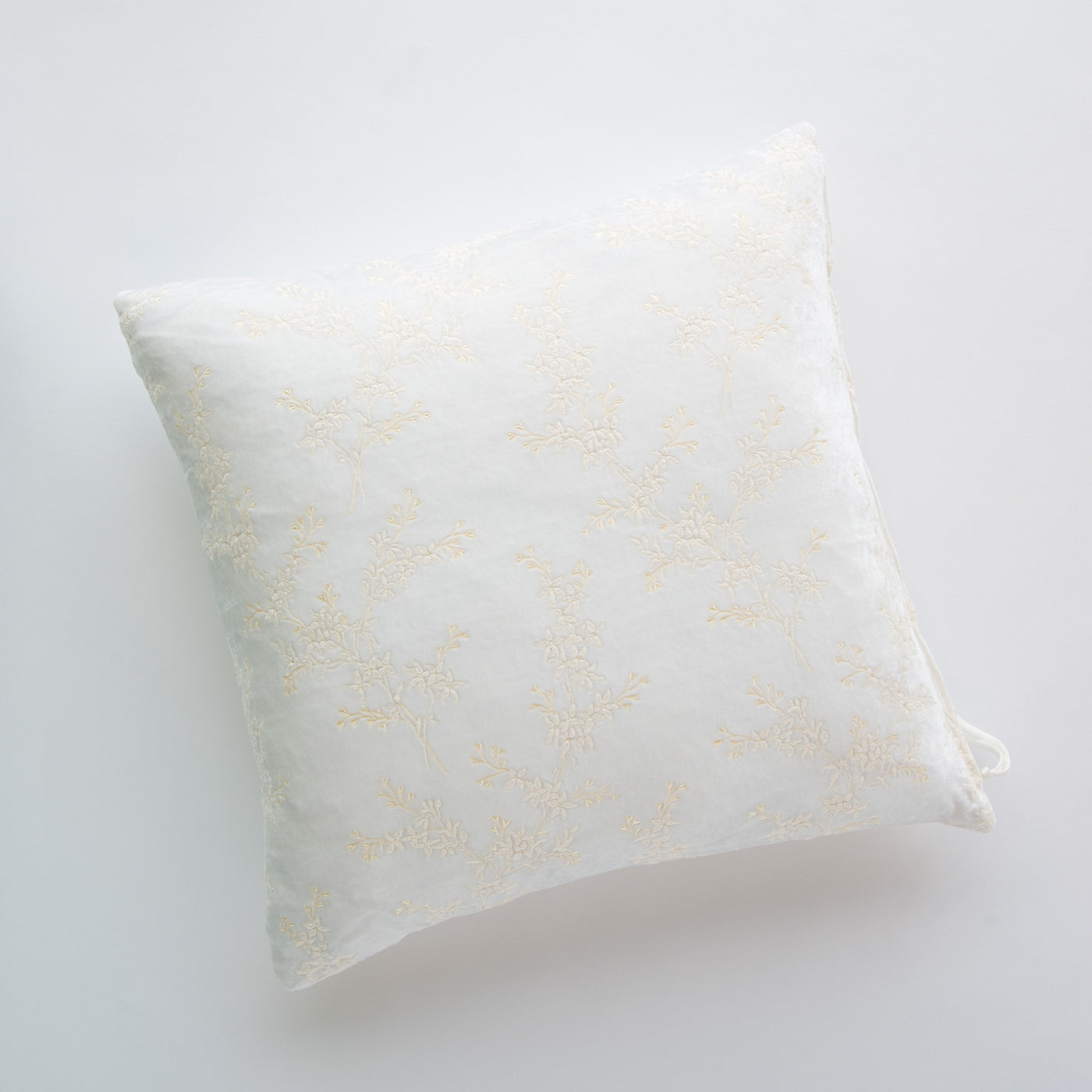 Bella Notte Lynette throw pillow in Winter White with delicate gold embroidered floral branches.