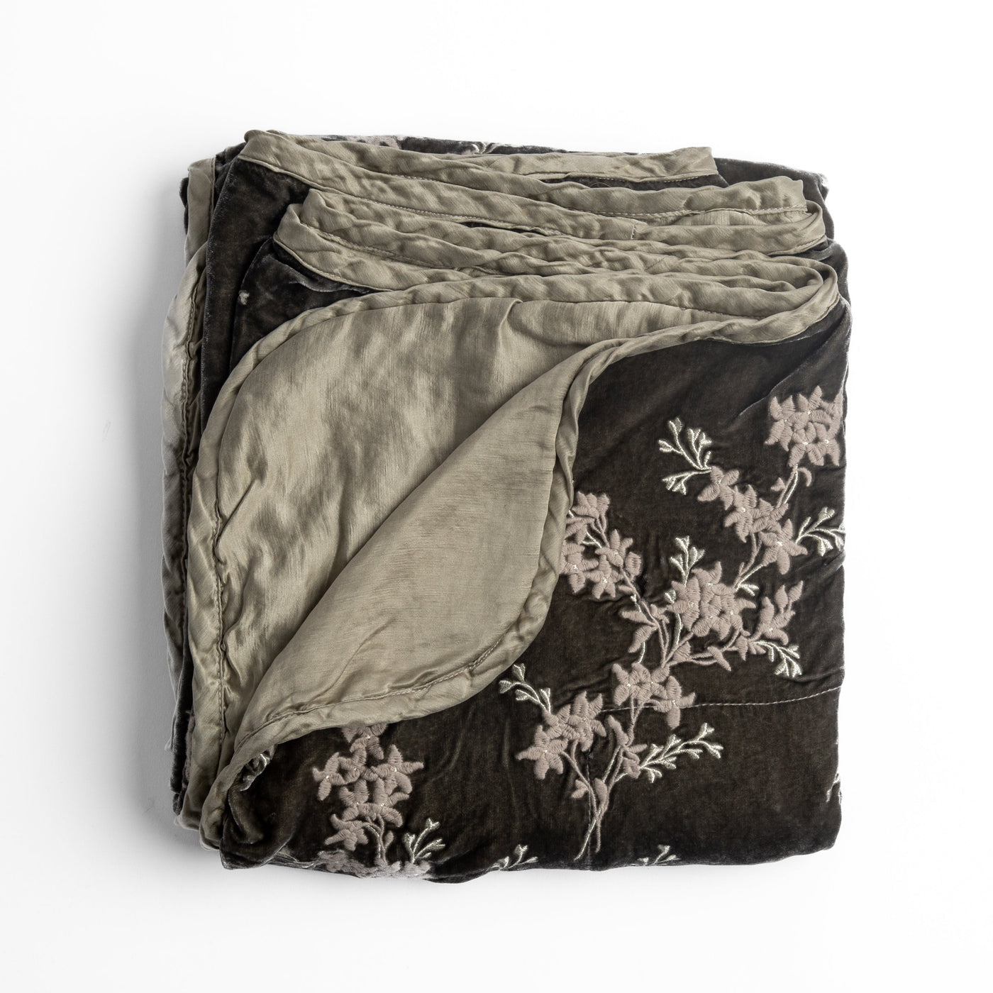 Bella Notte Lynette blanket in Fog folded to reveal linen reverse against floral embroidered face.