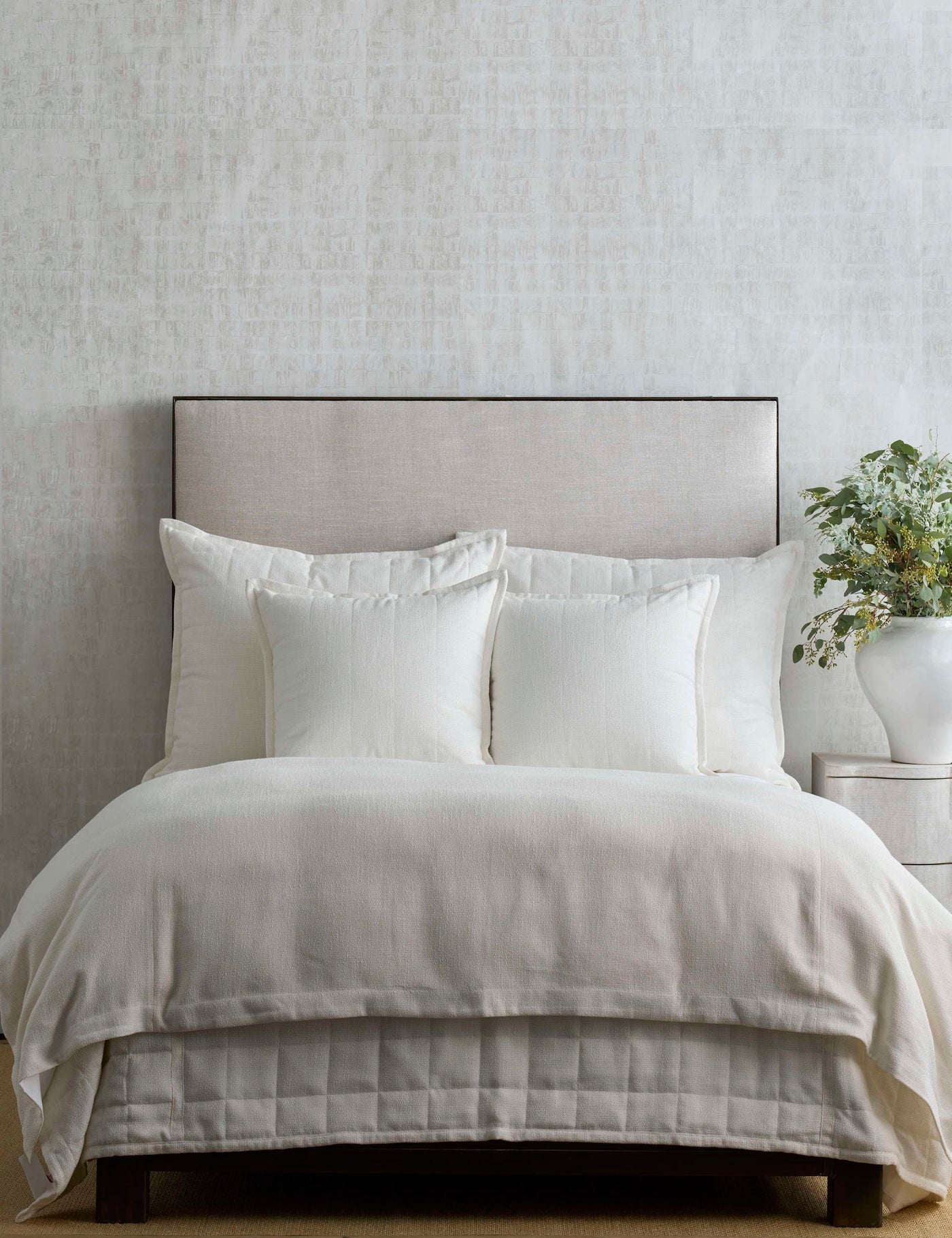 Ann Gish Macau duvet cover in ivory, styled on a bed with white euro shams and neutral linen bedding.