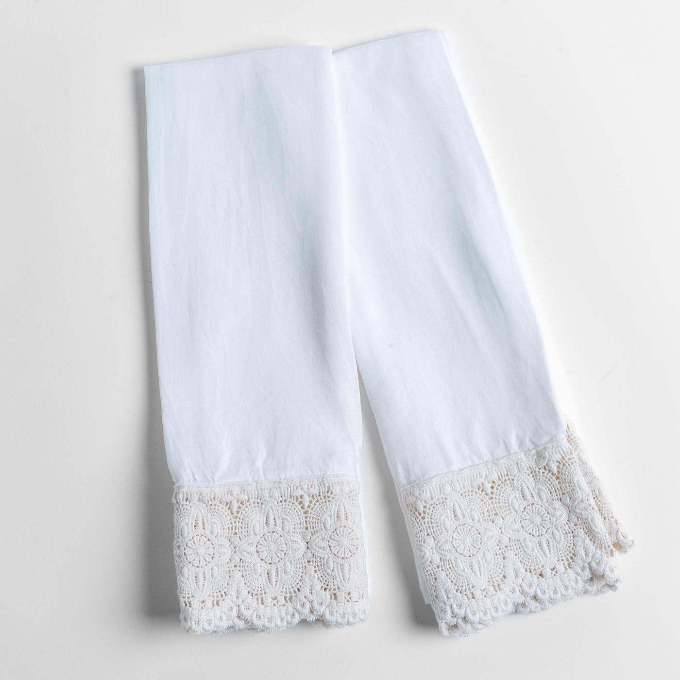 White Bella Notte Madera Luxe pillowcase cuffs with intricate floral lace trim detail.