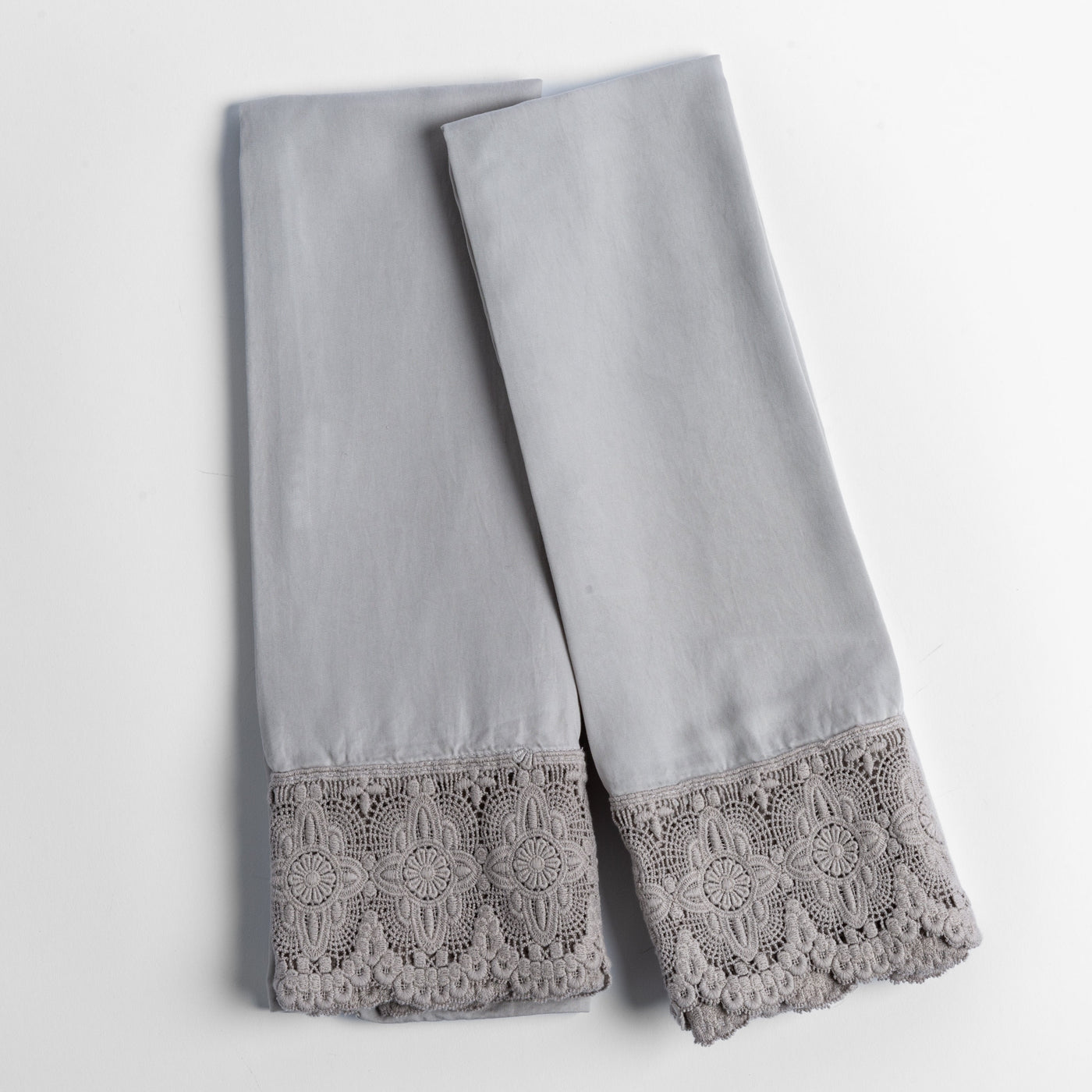 Fog Madera Luxe pillowcase hem, showing floral crochet lace trim detail in matching grey.