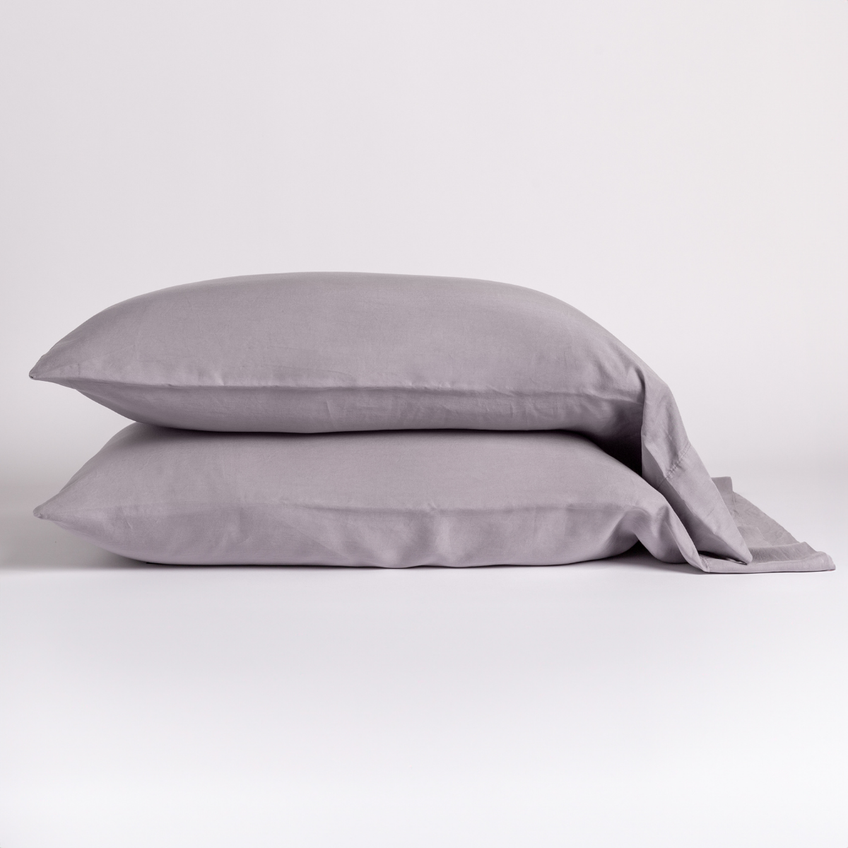 Two stacked Madera Luxe pillowcases in French Lavender, soft fabric with relaxed drape visible.