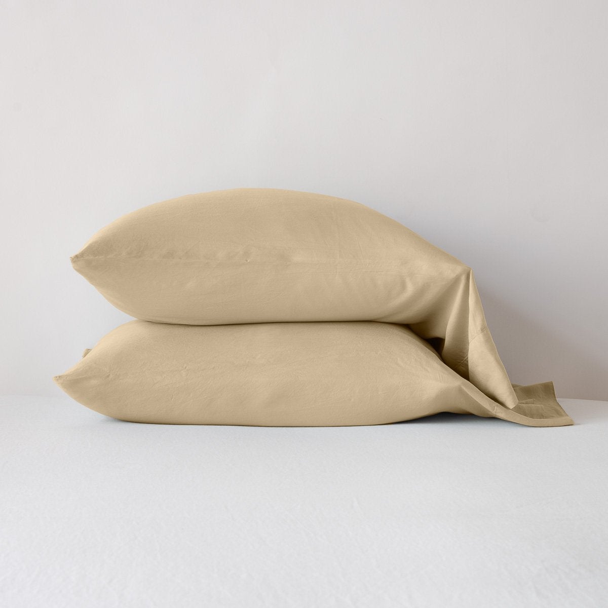Two Bella Notte Madera Luxe pillowcases stacked in Honeycomb, shown on a white surface.