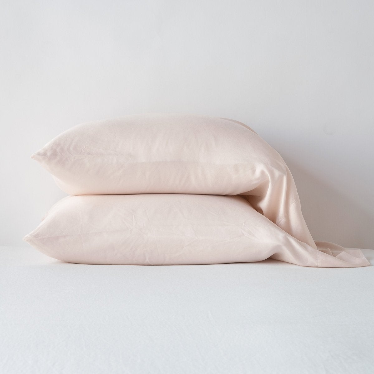 Two Pearl Bella Notte Madera Luxe pillowcases stacked against a white background.