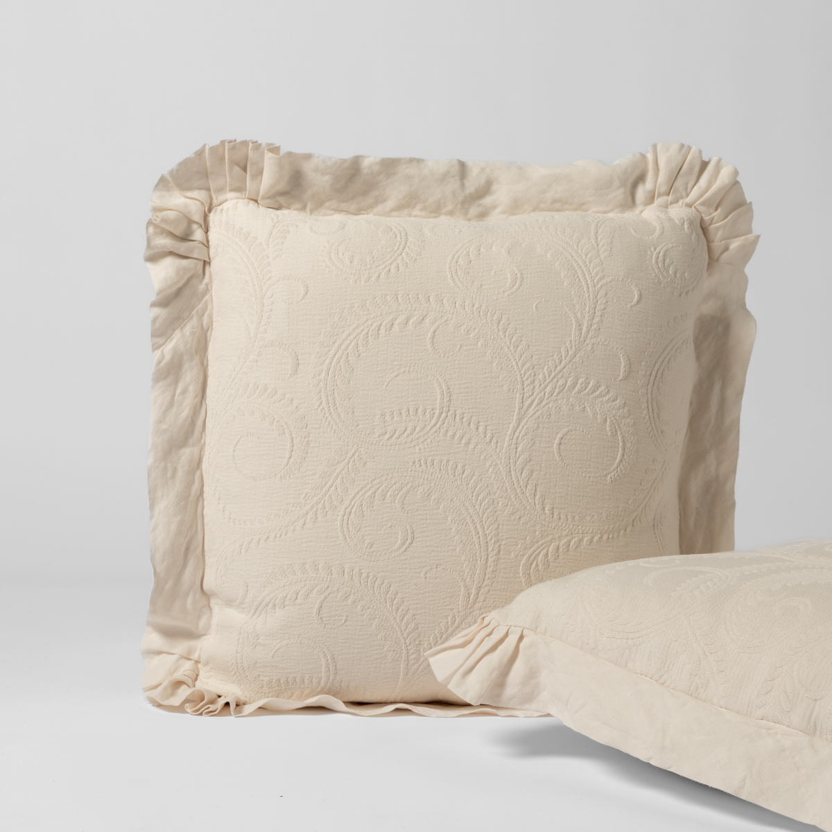 Bella Notte Marisette sham in Natural, showing ruffled edge and embroidered floral detail.
