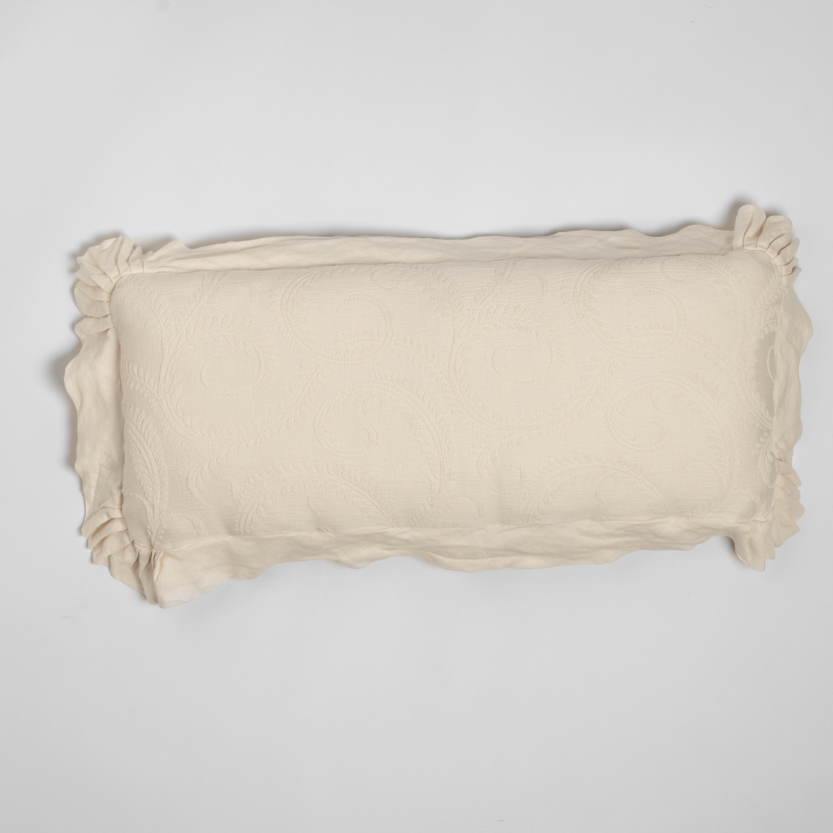 Bella Notte Marisette throw pillow in Natural, ruffled trim detail, flat lay view.