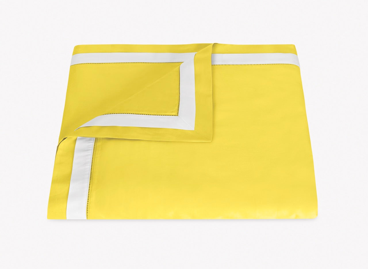 Image of Matouk Ambrose duvet in color lemon bone.