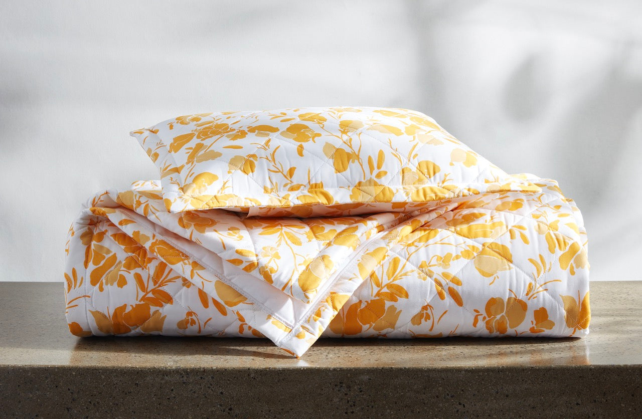 Image of Matouk Alexandra quilts items in a stack in color goldenrod.