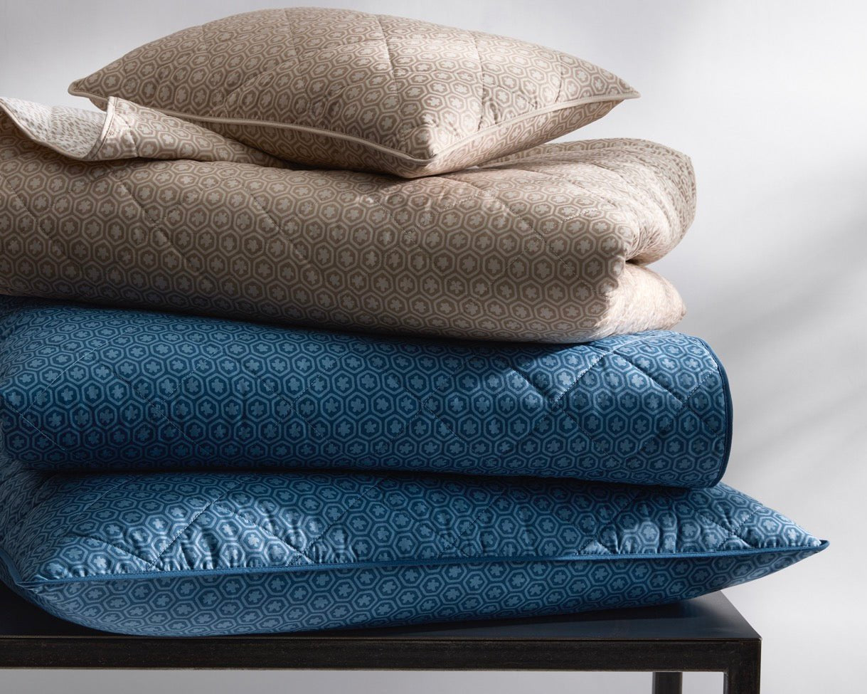 Image of Matouk Levi quilt in color items in a stack.