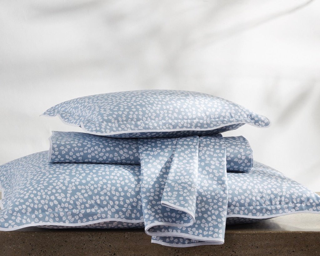 Image of Matouk Margot items in a stack hazy blue Reverse.