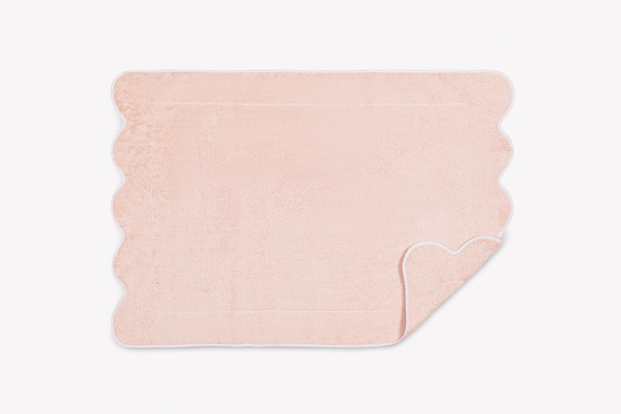 Image of Matouk Cairo scallop tub mat in color blush white.