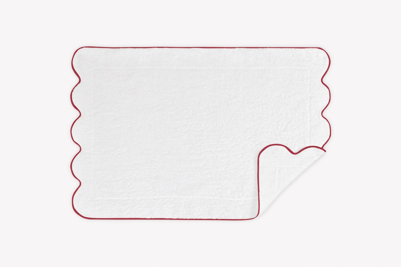 Image of Matouk Cairo scallop tub mat in color cherry.