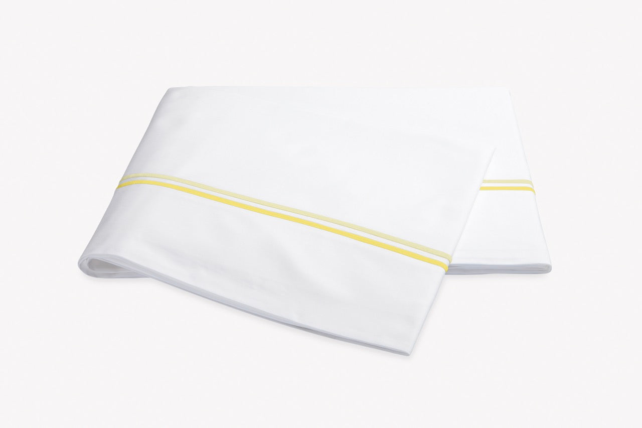 Image of Matouk Essex flat sheet in color lemon.