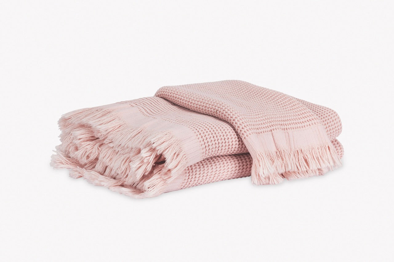 Image of Matouk Kiran towels in color blush.