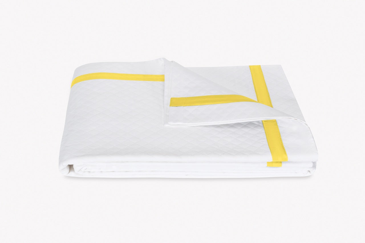 Image of Matouk Lowell matelasse coverlet in color lemon.