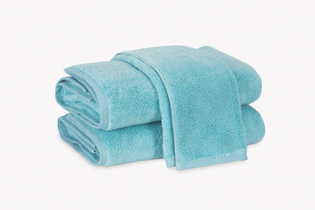 Image of Matouk Milagro towels in color Bahama blue.