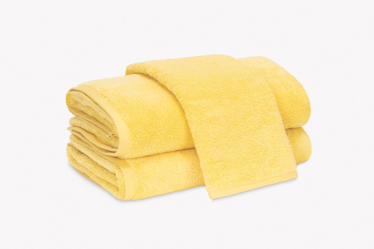 Image of Matouk Milagro towels in color canary.