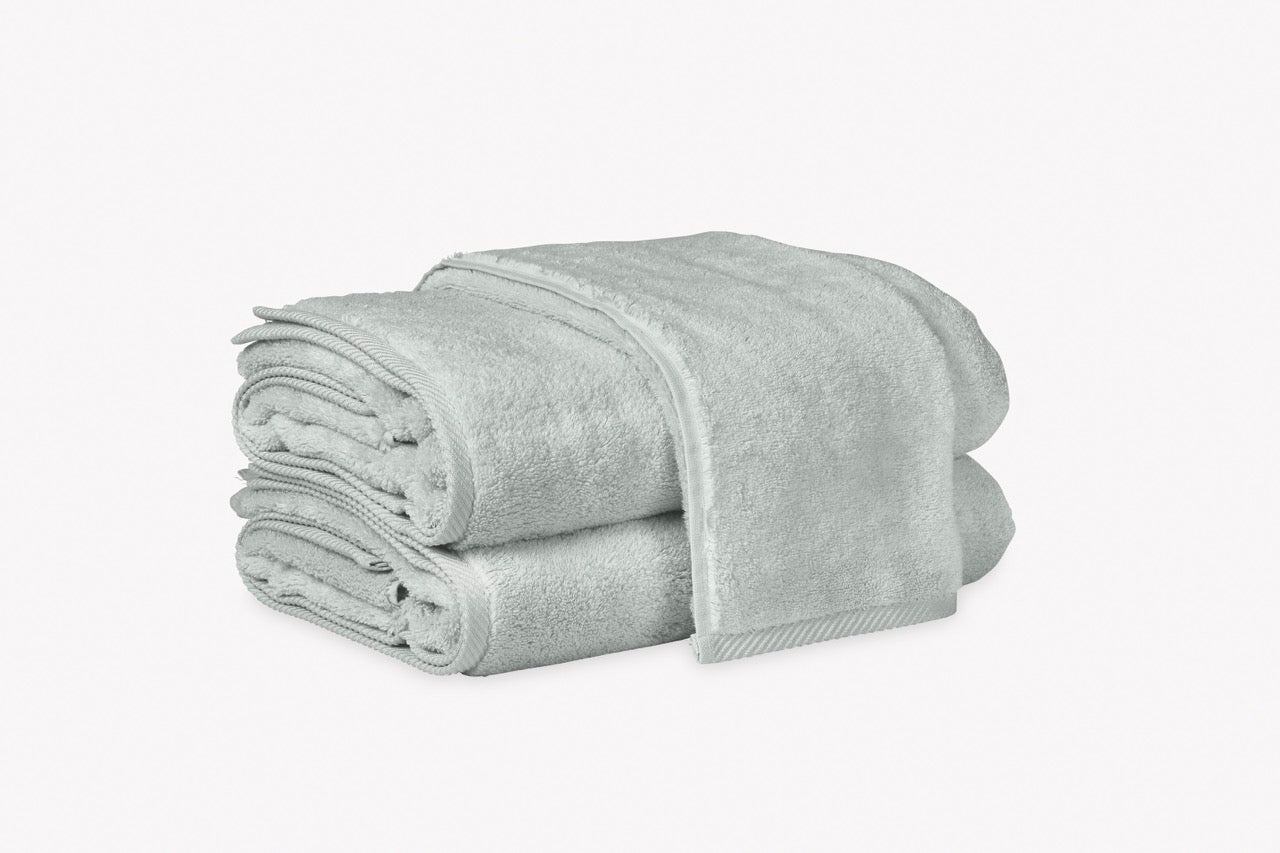 Image of Matouk Milagro towels in color pool.