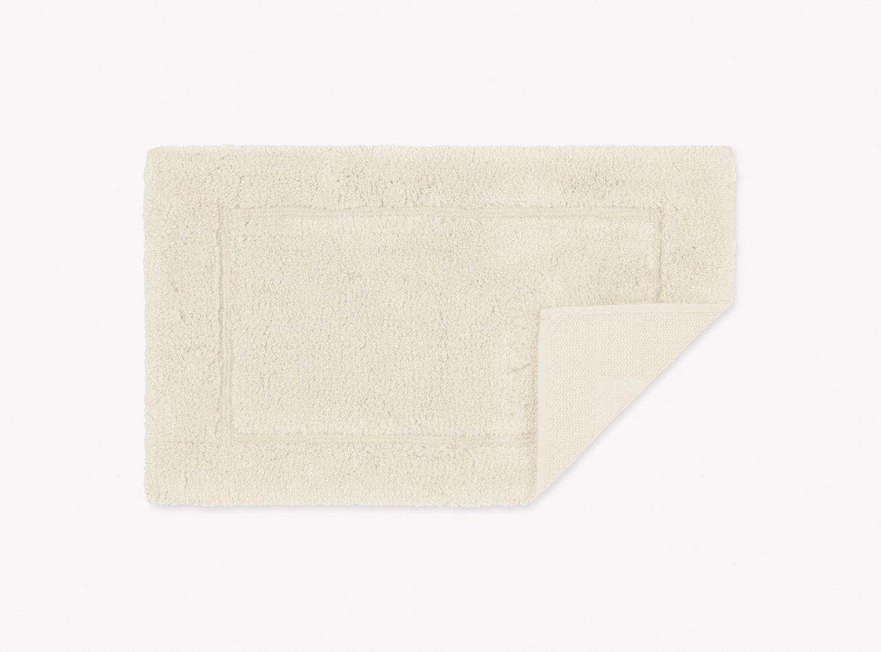 Image of Matouk Milagro small bath rug in color ivory.