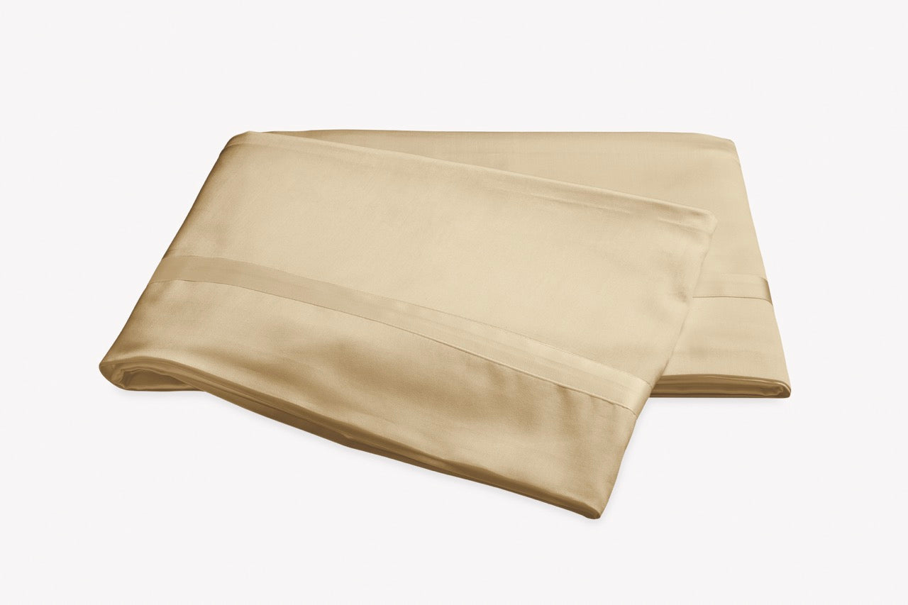 Image of Matouk Nocturne flat sheet in color honey.