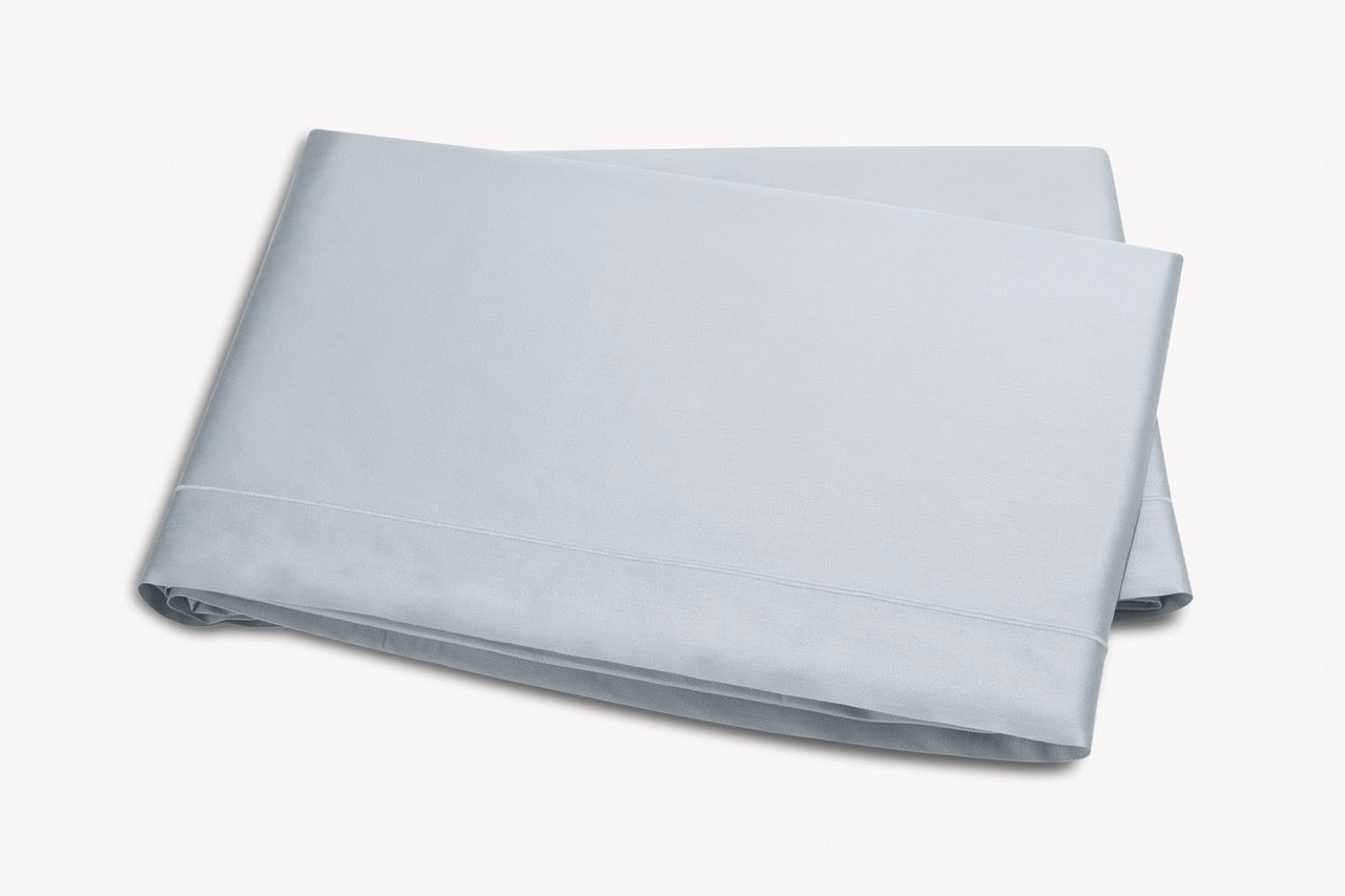 Image of Matouk Talita satin stitch flat sheet in color pool.