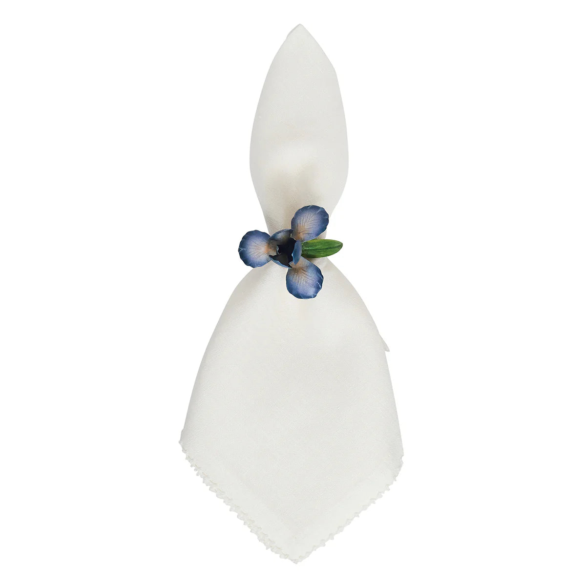 Ivory linen napkin gathered through a blue floral enamel Juliska napkin ring.