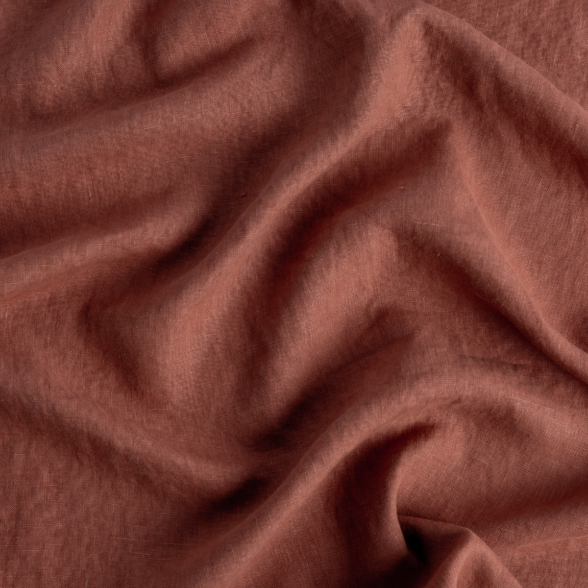 Close-up of Autumn Austin throw pillow fabric showing soft draped linen texture.