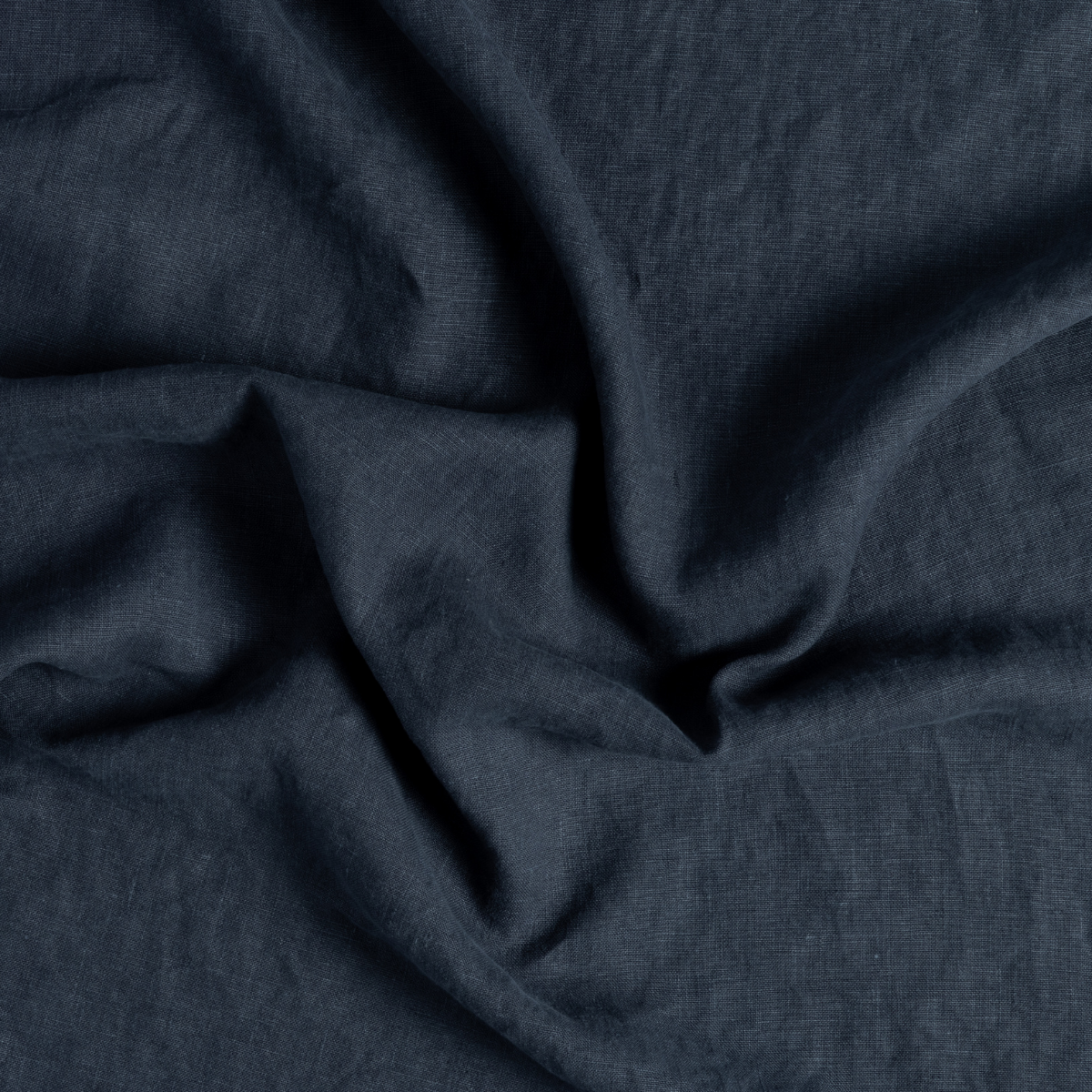 Close-up of Slate linen fabric with soft natural drape and subtle texture.