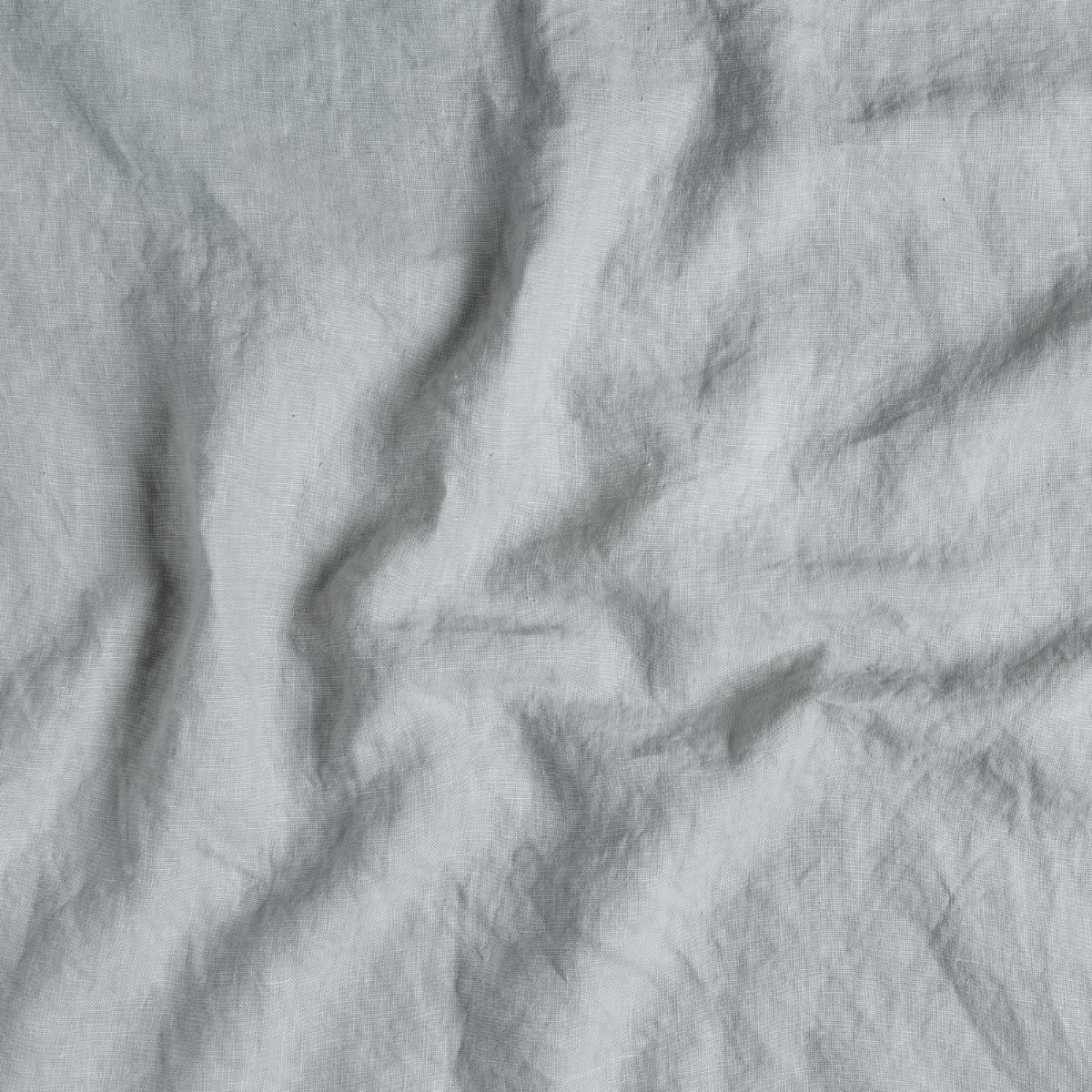 Close-up of Cloud linen fabric with natural relaxed draping and soft texture.
