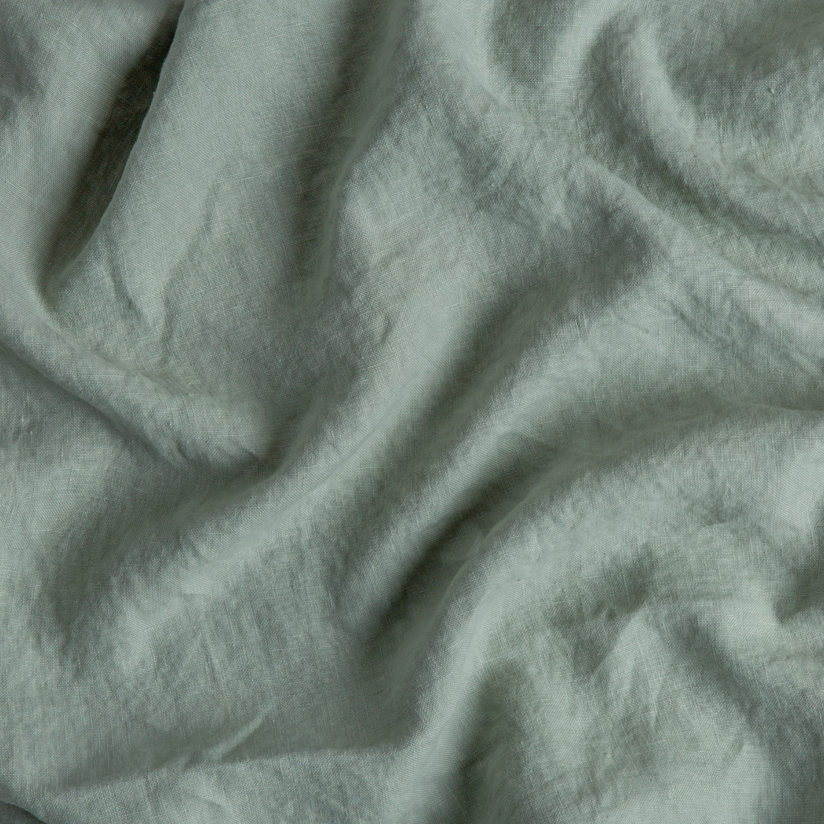 Close-up of Eucalyptus linen fabric with soft draping and natural wrinkled texture.