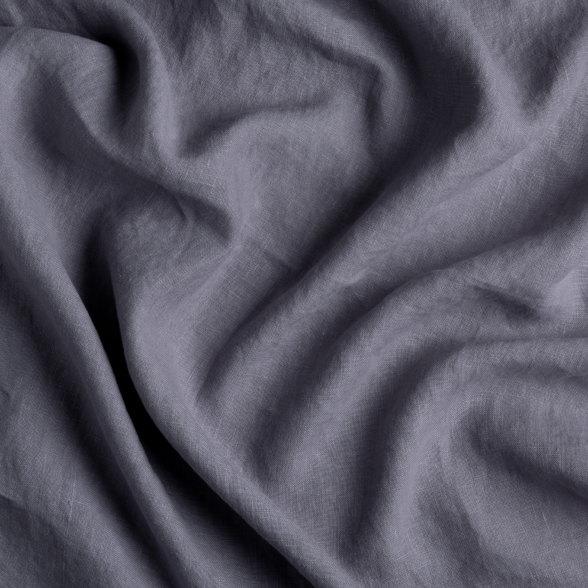 Close-up of French Lavender linen fabric with soft, natural draping and relaxed texture.