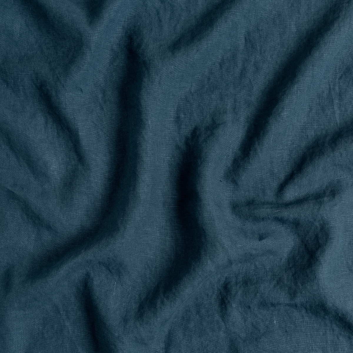 Close-up of Midnight linen guest towel fabric showing soft drape and natural texture.