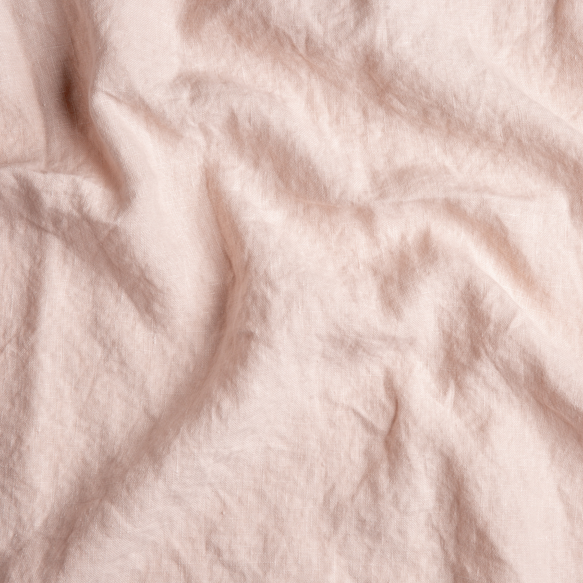 Close-up of Pearl linen fabric with soft draping and natural wrinkle texture.