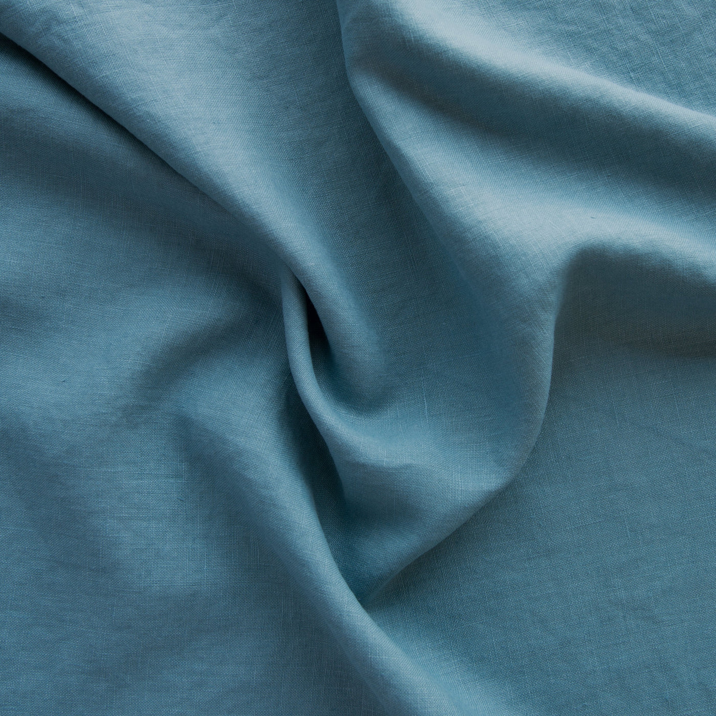 Close-up of Bella Notte Austin sham in Cenote, showing draped linen texture.