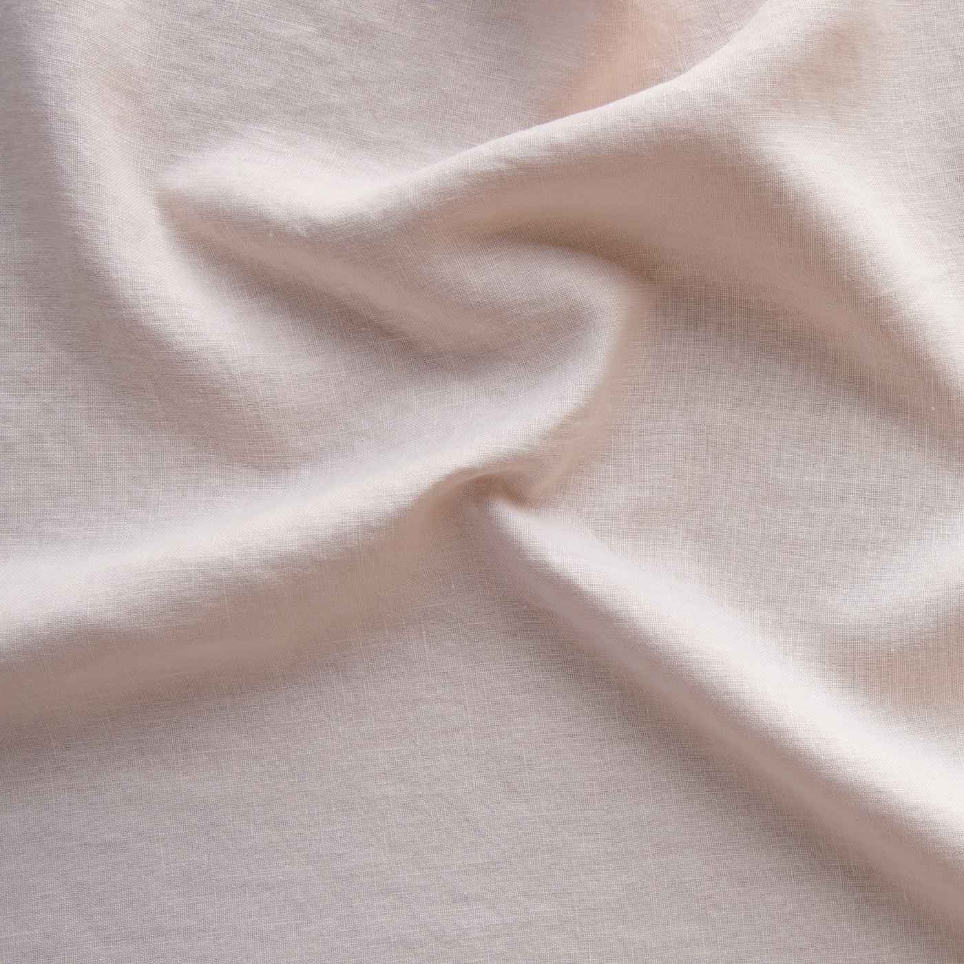 Close-up of Bella Notte Austin sham in Pearl, showing soft draped linen texture.
