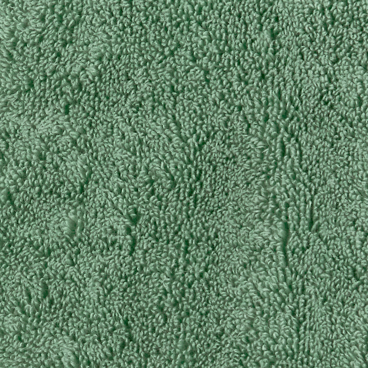 Close-up of sage green terry cloth texture showing dense, looped cotton pile.
