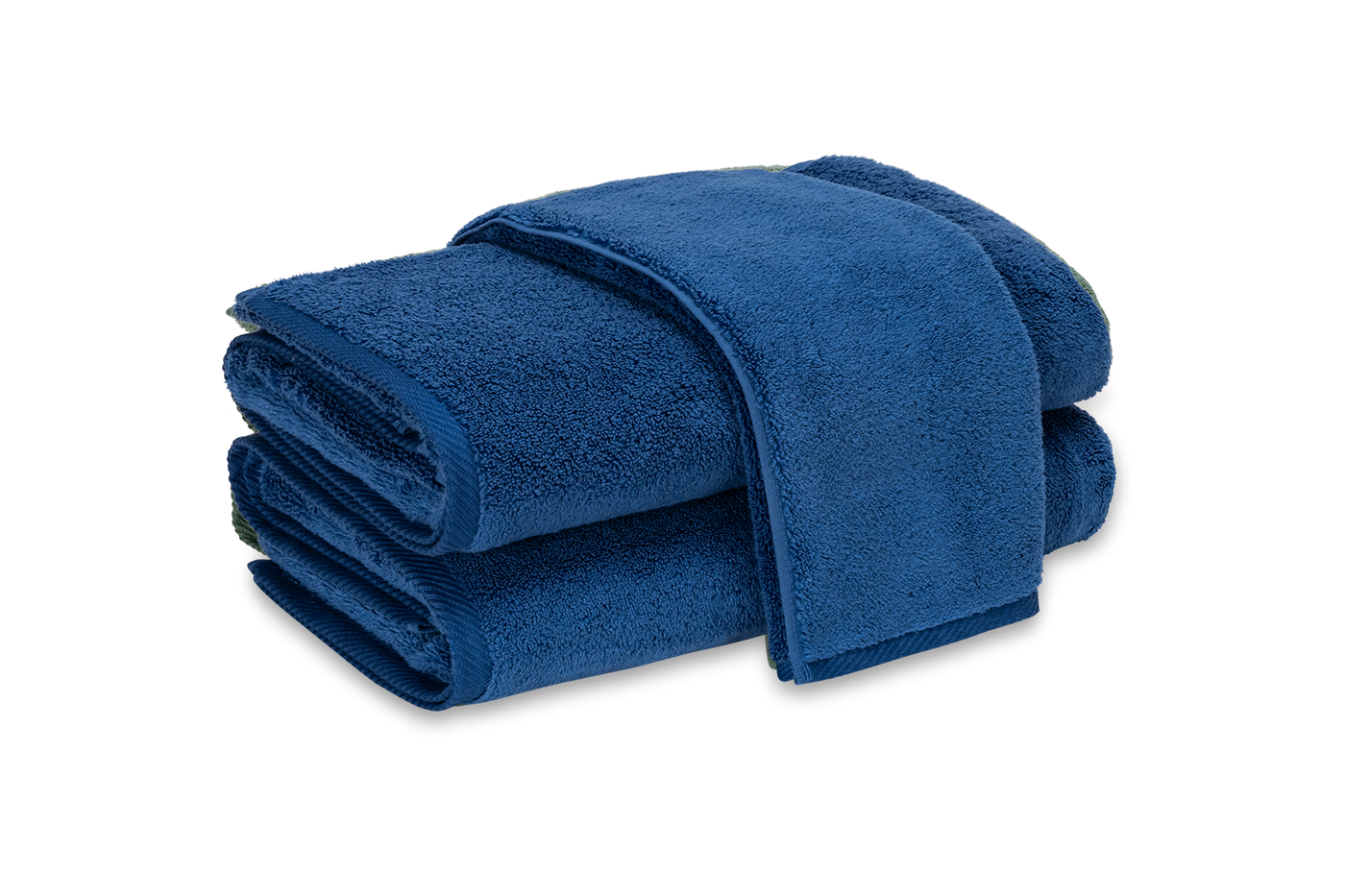 Stack of two Matouk Milagro bath sheets folded in deep navy terry cotton.